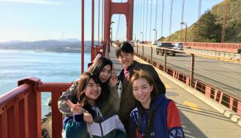 A group of people touring the Golden Gate Bridge.